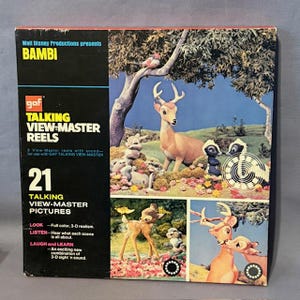 May include: A vintage Bambi Talking View-Master Reels box. The box features the Walt Disney Productions logo and the title "Bambi." It includes 21 talking View-Master pictures. The box has colourful images of Bambi and his friends.
