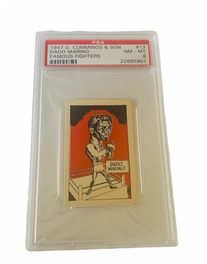 May include: A vintage trading card featuring a black and white illustration of a boxer in a boxing ring. The card is red, white, and black. The card is labeled "D. Cummings & Son Famous Fighters" and "Dado Marino #13".