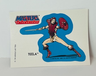 Pegatina de tarjeta coleccionable de Masters of Universe de 1984, rompecabezas de Mattel, armadura de Teela de He-Man