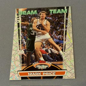 May include: A Topps basketball card featuring Mark Price in a Cleveland Cavaliers uniform. The card has a silver and orange design with the words "BEAM TEAM" at the top. The card also has the text "MARK PRICE".
