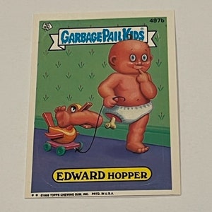 May include: A Garbage Pail Kids trading card featuring a cartoon baby with a red body and a white nappy. The baby is holding a toy duck on a string. The card is green and has the text "Garbage Pail Kids" and "Edward Hopper" on it.