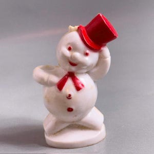 Figura de boneco de neve natalino antigo em baquelite, com chapéu vermelho, estilo vintage B4.
