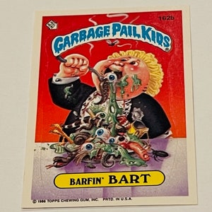 May include: A Garbage Pail Kids trading card featuring a cartoon character called Barfin' Bart. The character is shown with green slime and eyeballs coming out of his mouth. The card is red, yellow, and blue with the text "Garbage Pail Kids" and "Barfin' Bart".