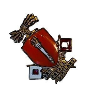May include: A gold-colored pin with a red shield, a torch, and a banner that reads "Pro Patria Vigilans".