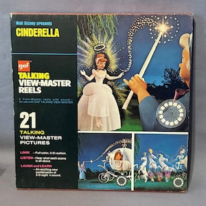 May include: Vintage Cinderella View-Master reel set. The box features Cinderella in a white gown, a fairy godmother with a wand, and a carriage. The box reads "Walt Disney presents CINDERELLA" and "TALKING VIEW-MASTER REELS".
