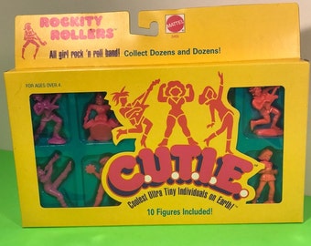 1986 MATTEL CUTIE FIGURES moc nib sealed C.U.T.I.E. unopened Rockity Rollers girl rock roll band like Muscle action toys vintage BMC6