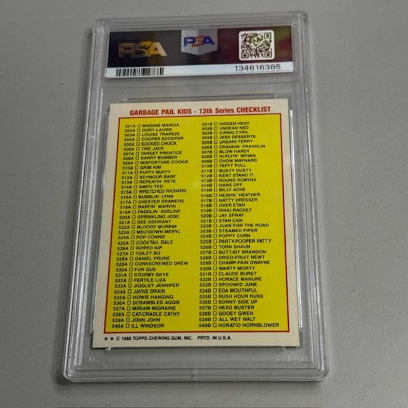 May include: A graded trading card featuring a Garbage Pail Kids 13th Series checklist. The card is encased in a clear plastic holder with a PSA label and serial number. The checklist includes various character names and card numbers.