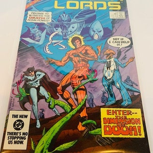 May include: A comic book cover featuring a group of characters in a fantasy setting. The cover is titled "Power Lords" and features a green plant with a large, orange character standing on top of it. The text "Enter--The Dimension of Doom!" is featured in a yellow box.