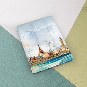 May include: A watercolor illustration of famous landmarks from around the world, including the Eiffel Tower, the Statue of Liberty, and Big Ben, on a tablet case.