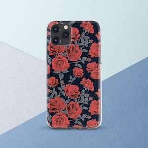 May include: A clear phone case featuring a pattern of red roses on a dark navy blue background. The roses are detailed with gray leaves and stems, creating a floral design. The case has a glossy finish and covers the phone's back and sides.