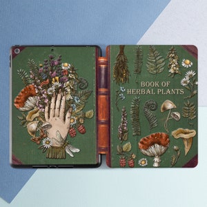 May include: A green and brown book cover with the title "Book of Herbal Plants". The cover features illustrations of various plants, mushrooms, and a hand reaching out from the left side.