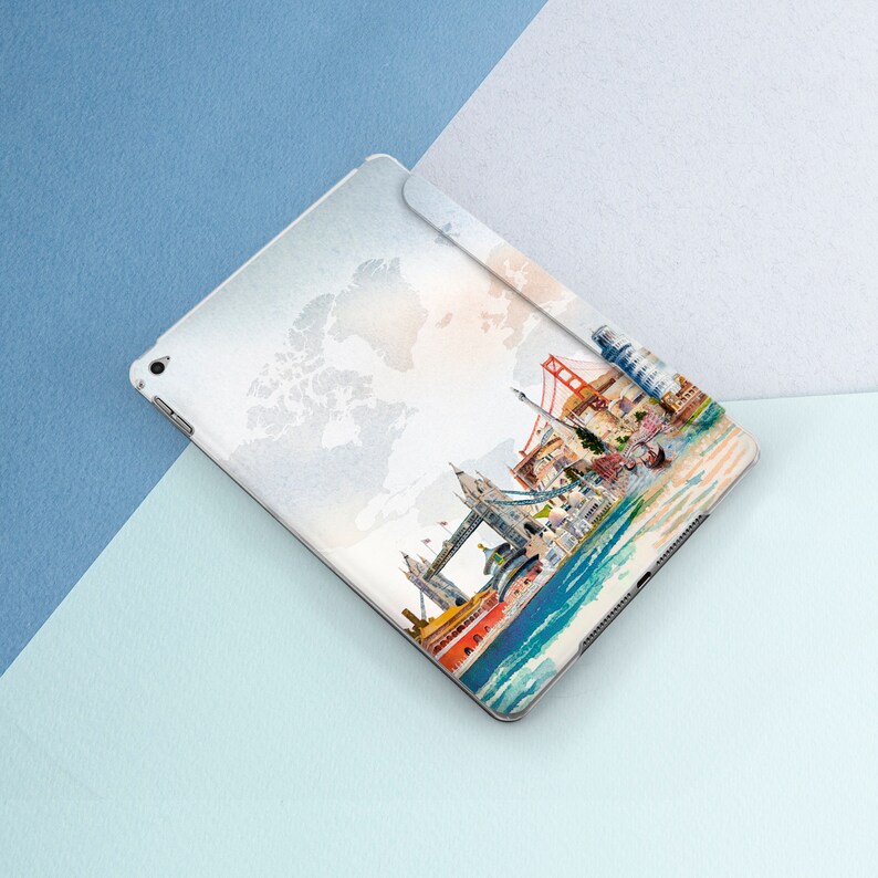 May include: A white iPad case with a watercolor design of famous landmarks in London, including Big Ben, the London Eye, and Tower Bridge. The design also includes a world map in the background.