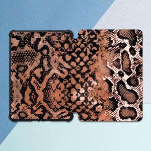 May include: A brown and black snakeskin pattern phone case with a black border.