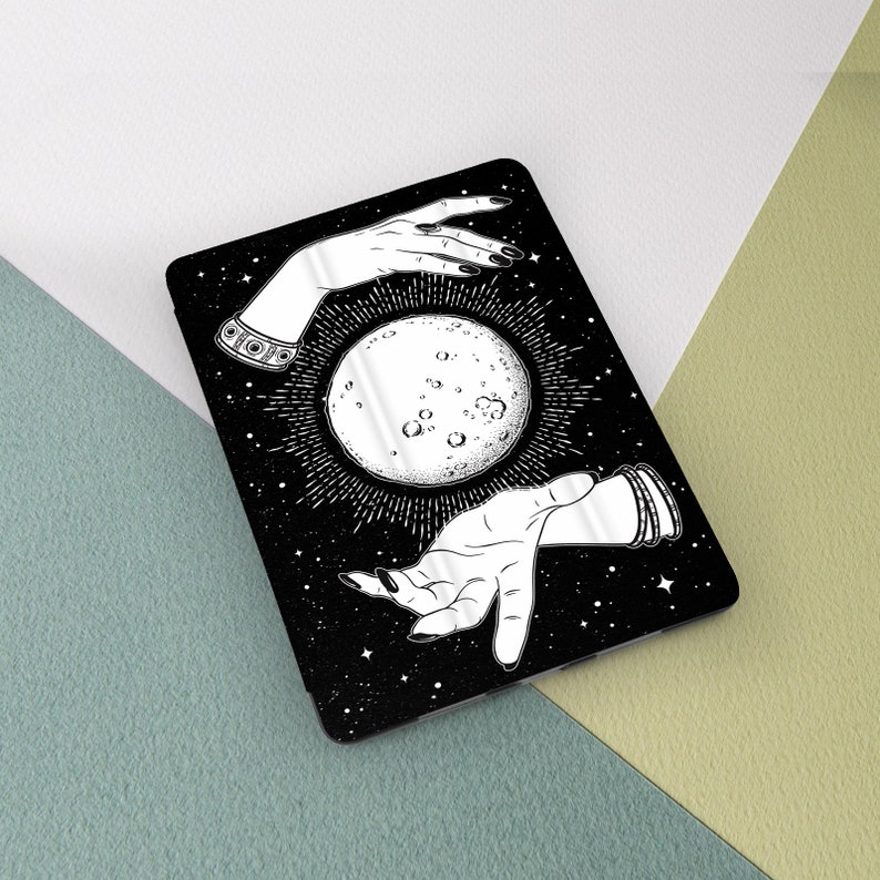 May include: A black and white illustration of two hands reaching towards a full moon with a starry background.