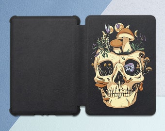 May include: A black and white illustration of a skull with mushrooms growing out of the top. The skull has a detailed design with a smile and eyes. The mushrooms are various colours and shapes.