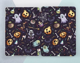 May include: A black and purple iPad case with a Halloween-themed pattern. The pattern includes ghosts, pumpkins, bats, candy corn, and other spooky elements.