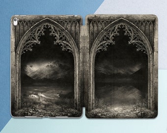 May include: A black and white image of two stone archways with a view of a mountain range and a valley through each archway.