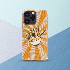 Puede incluir: Una funda transparente para teléfono con una ilustración retro de un cuenco de fideos ramen. El fondo es un patrón de rayos de sol amarillo y naranja.