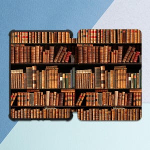 May include: A close-up of a bookshelf filled with antique books. The books are arranged in rows on the shelves, with the spines facing out. The books are all different sizes and colors, and some have decorative covers.