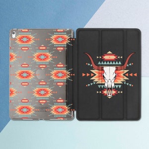 May include: A black iPad case with a geometric pattern and a skull with horns design. The case has a flap that covers the screen.