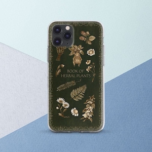 May include: A clear phone case with a green background and gold accents. The case features a vintage illustration of various herbal plants and the text "Book of Herbal Plants".