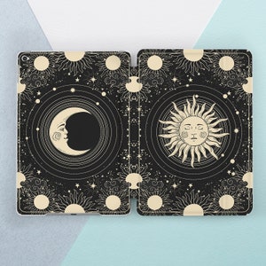 May include: A black and white illustration of a crescent moon and a sun with a face on a black background with a repeating pattern of stars, moons, and suns.