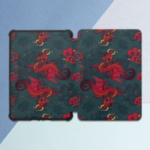 May include: A black phone case with a repeating pattern of red dragons and clouds on a dark teal background.