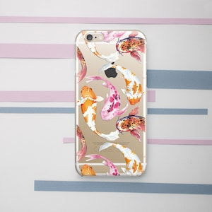 May include: Clear phone case with a colorful koi fish pattern. The fish are painted in shades of orange, pink, and white.