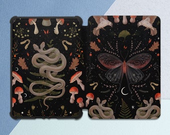 May include: A black phone case featuring a repeating pattern of mushrooms, snakes, butterflies, and other woodland elements. The design is on a black background with white stars and a crescent moon.