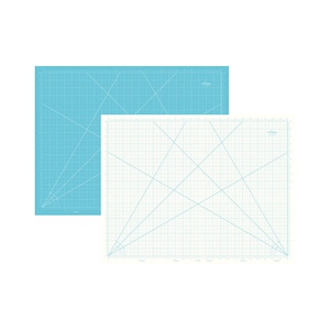 May include: Two cutting mats, one aqua blue and one white, are displayed. Both mats have a grid pattern with diagonal lines and measurement markings along the edges. The aqua blue mat is positioned behind the white mat.
