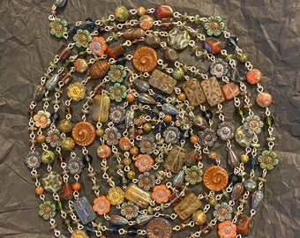 Those Who Trade With Merfolk - long linked necklace - sterling silver - Czech glass - Swarovski crystal - unakite - rhyolite - glass - etc