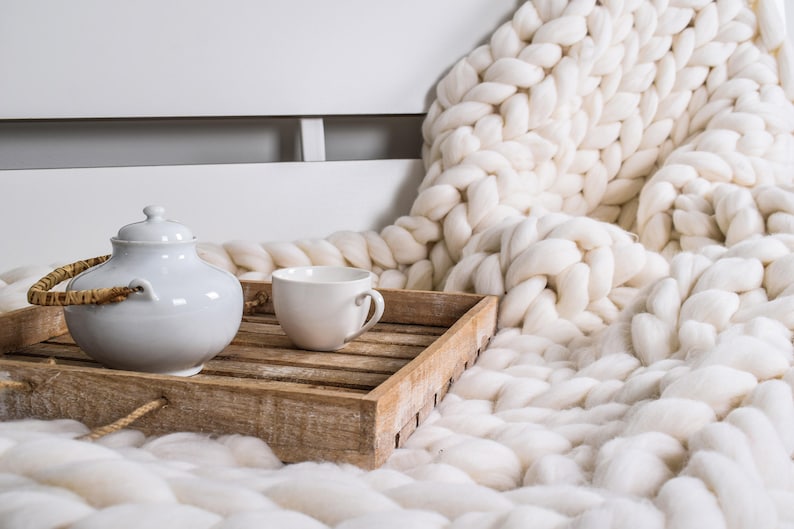 Chunky white knit throw