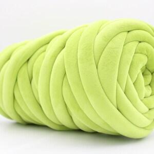 A collection of soft, chunky velvet yarn in a variety of beautiful colors, neatly arranged to showcase the available options for a handmade chunky knit blanket. The vibrant and neutral shades allow for a perfect match to any home décor style.