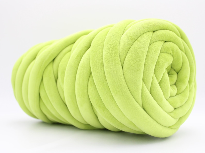 A collection of soft, chunky velvet yarn in a variety of beautiful colors, neatly arranged to showcase the available options for a handmade chunky knit blanket. The vibrant and neutral shades allow for a perfect match to any home décor style.