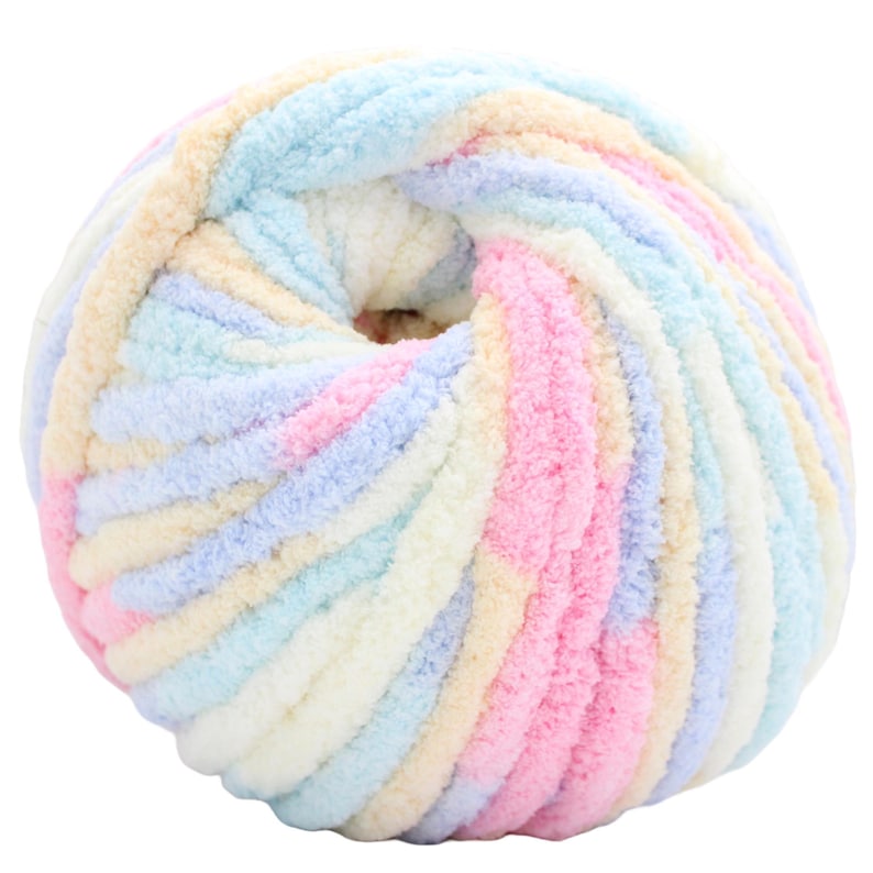 A ball of soft, colorful yarn in pastel shades of pink, blue, yellow, and white. The yarn is thick and fluffy, ideal for knitting or crocheting projects. The ball has a hole in the center.