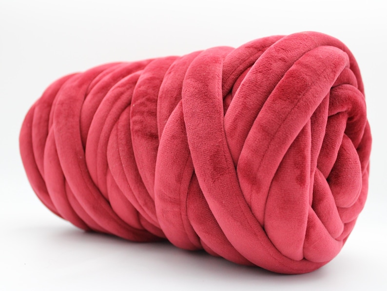 A collection of soft, chunky velvet yarn in a variety of beautiful colors, neatly arranged to showcase the available options for a handmade chunky knit blanket. The vibrant and neutral shades allow for a perfect match to any home décor style.