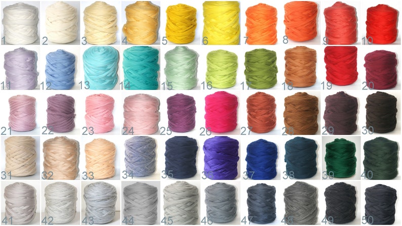 May include: A collection of 50 spools of colorful yarn, each in a different shade. Colors range from white, cream, and yellow to orange, red, and burgundy. Other colors include teal, green, purple, pink, and gray.