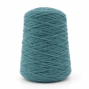 May include: A teal-colored yarn cone, tightly wound with visible texture. The yarn is a solid, muted teal, and the cone shape tapers from a wider base to a narrower top. Ideal for knitting and crochet projects.