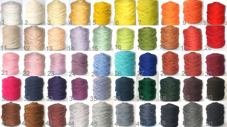 May include: Fifty skeins of yarn in various colors, including white, beige, light blue, green, yellow, orange, red, pink, purple, brown, gray, and black. Each skein is labeled with a number from 1 to 50.