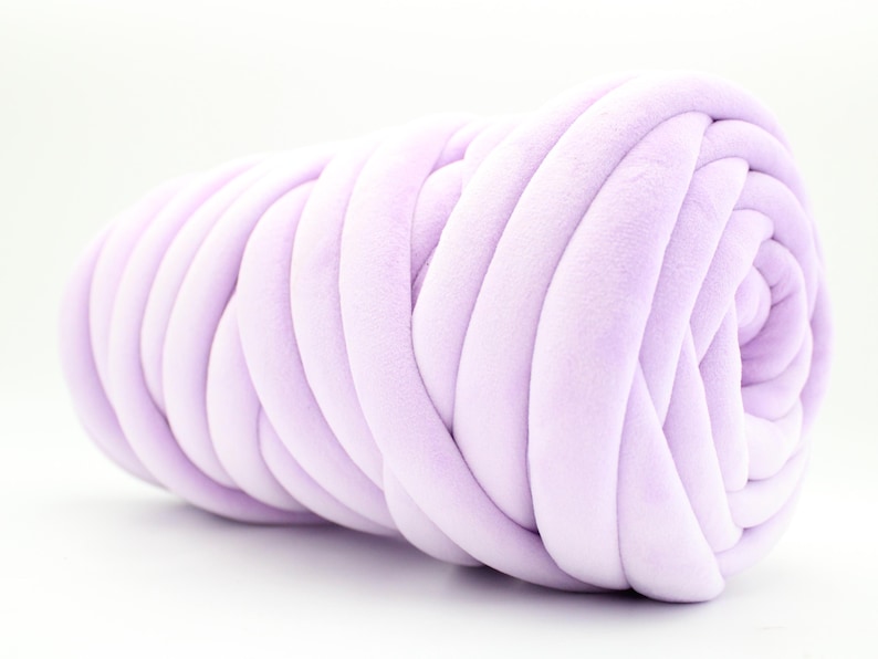 A collection of soft, chunky velvet yarn in a variety of beautiful colors, neatly arranged to showcase the available options for a handmade chunky knit blanket. The vibrant and neutral shades allow for a perfect match to any home décor style.
