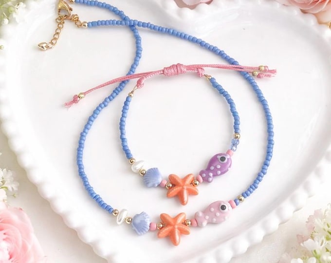 Bracelet et collier inspiré de la mer – Perles pastel bleu avec étoile de mer corail, coquillage et poisson