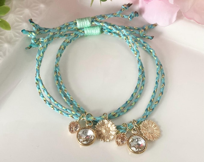 Turquoise blue cord bracelet with gold charm