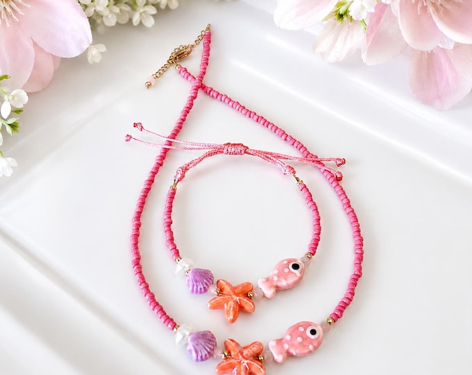 Bracelet et collier inspiré de la mer – Perles pastel bleu et vert avec étoile de mer corail, coquillage et poisson