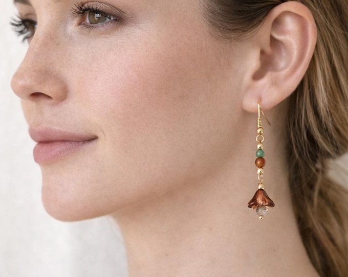 Boucle oreille associés à des bruns chaleureux composent une palette naturelle et apaisante, tandis que de délicates touches de topaze