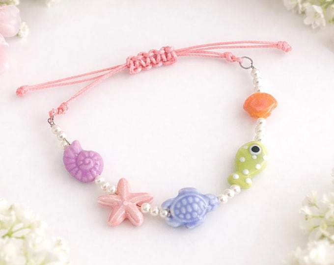 Bracelet ajustable blanc et perle ceramic rose