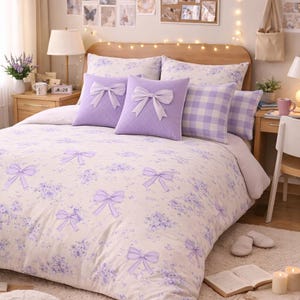 May include: A bedroom with a bed dressed in a floral duvet cover and lavender pillows with bow details. The room is decorated with fairy lights and photos. The colour scheme is soft and neutral, creating a cosy atmosphere.