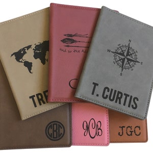 May include: Six passport holders in different colors and materials. The holders have various designs including a world map, arrows, a compass, and initials. The holders are made of leather and have a stitched edge.