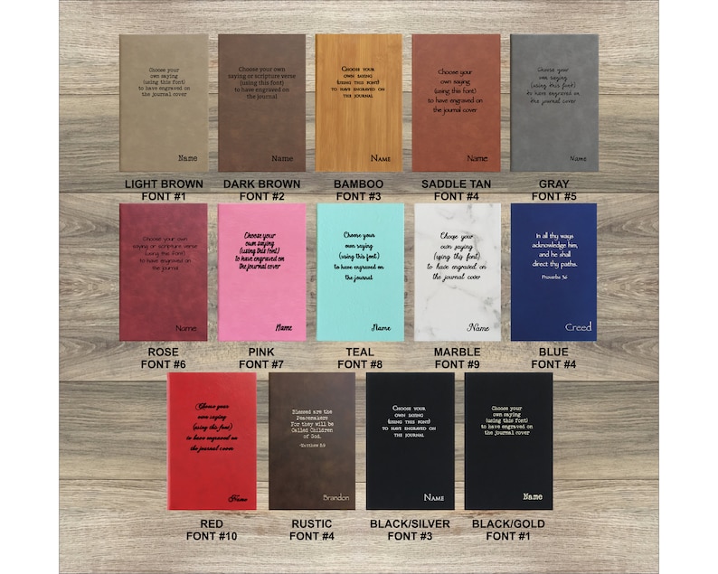 May include: A chart showing ten different leather-bound journals with various colors and fonts. The colors include light brown, dark brown, bamboo, saddle tan, gray, rose, pink, teal, marble, blue, red, rustic, black/silver, and black/gold. The fonts are numbered 1 through 10. The text on the journals says "Choose your own saying or scripture verse (using this font) to have engraved on the journal cover."