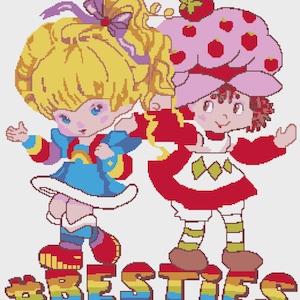 Puede incluir: Diseño de punto de cruz con dos personajes de dibujos animados. Uno tiene cabello rubio y viste un vestido azul, el otro tiene cabello rojo y viste un vestido rojo con un sombrero de fresa. La palabra "BESTIES" está escrita en colores arcoíris en la parte inferior.