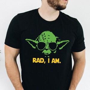 May include: Black t-shirt with a green Yoda wearing sunglasses and the text "RAD, I AM."